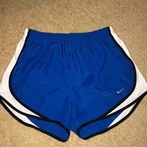 Blue nike shorts with white trim